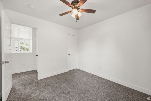 1552 Sumac Drive Logan, UT 84321 - Photo 43 of 72 Room featuring grey carpet, white walls, and a ceiling fan with integrated lighting