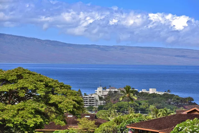 a view of a lake with a big yard