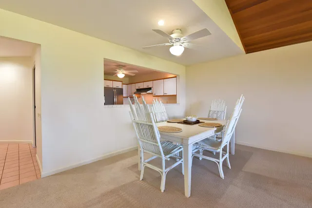 a bedroom with a bed and a large window with balcony view