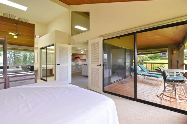 a view of a living room and bathroom with a sink