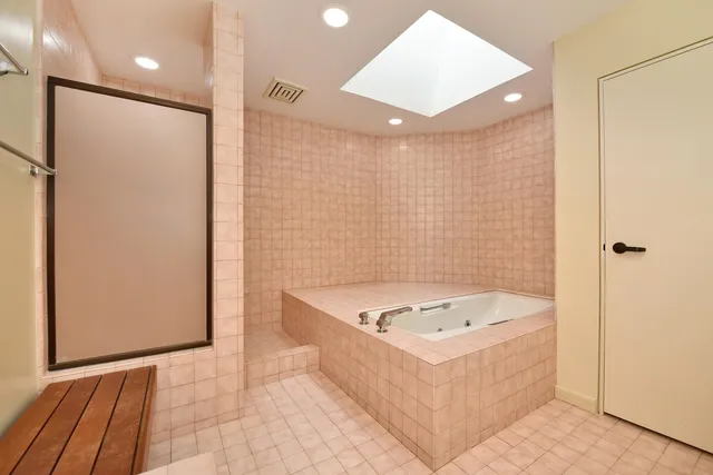 a bathroom with a double vanity sink and mirror
