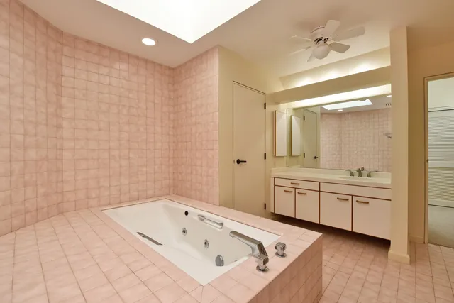 a kitchen with a sink refrigerator and cabinets