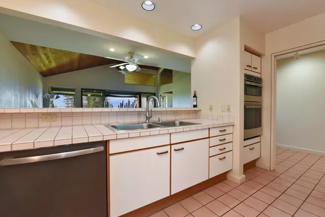 a bathroom with a sink toilet a shower and a mirror
