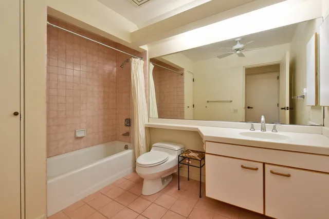 a spacious bedroom with a bed and a large window