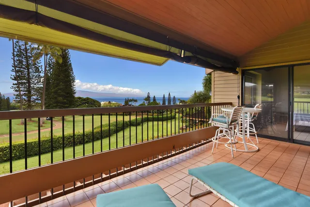 a view of a garden with a building in the background