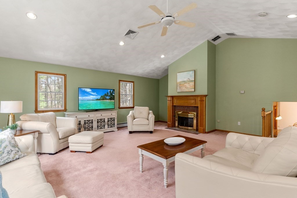 628 Boston Road Groton, MA 01450 - Photo 7 of 32 a living room with furniture and a fireplace