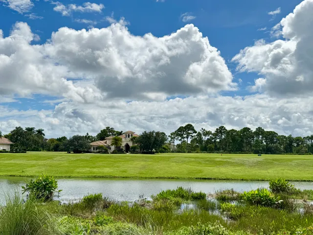 a view of a lake with houses in the back