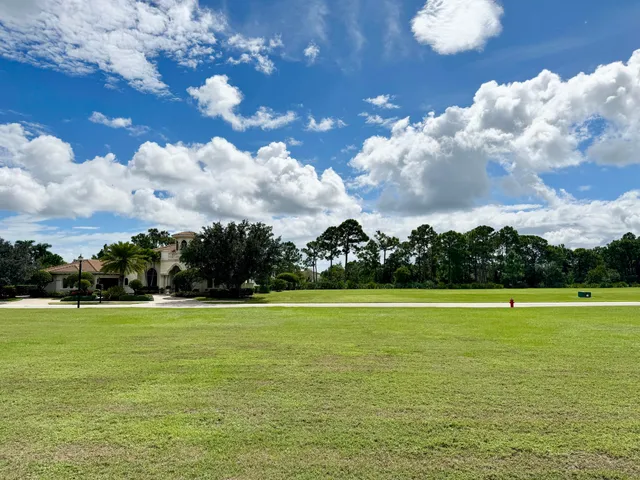 a view of a lake with houses in the background