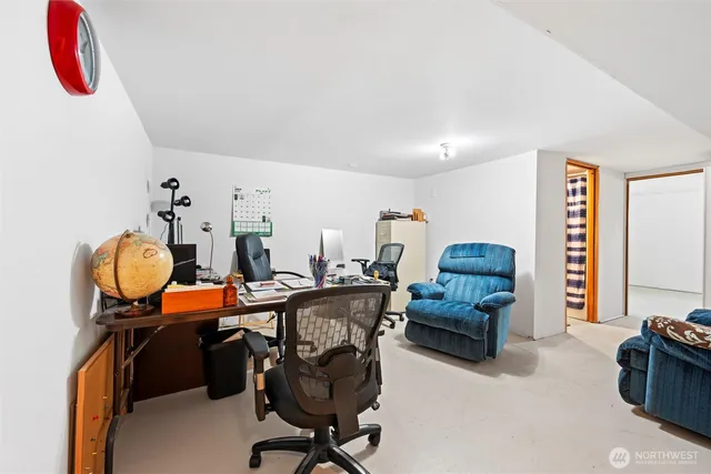 a living room with furniture and a chair