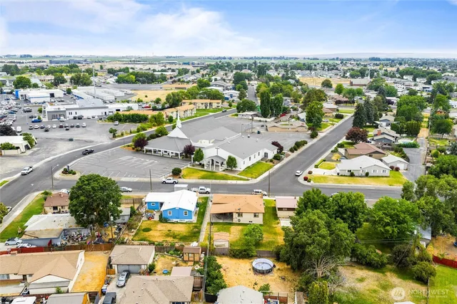 an aerial view of residential houses with outdoor space