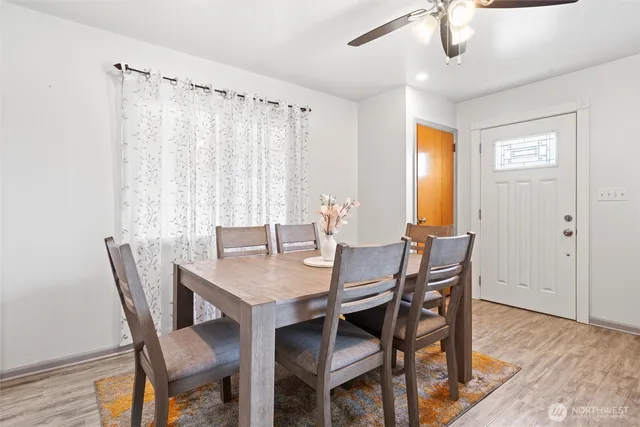 a view of a dining room with furniture window and wooden floor