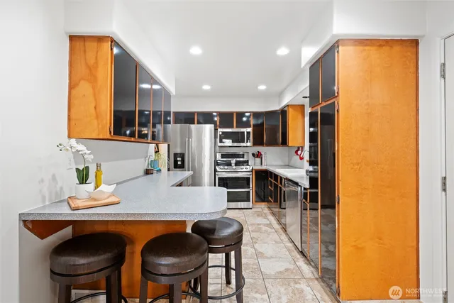 a kitchen with a table and chairs in it
