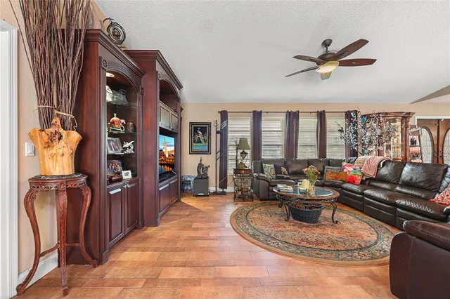a view of a dining room with furniture large windows and wooden floor