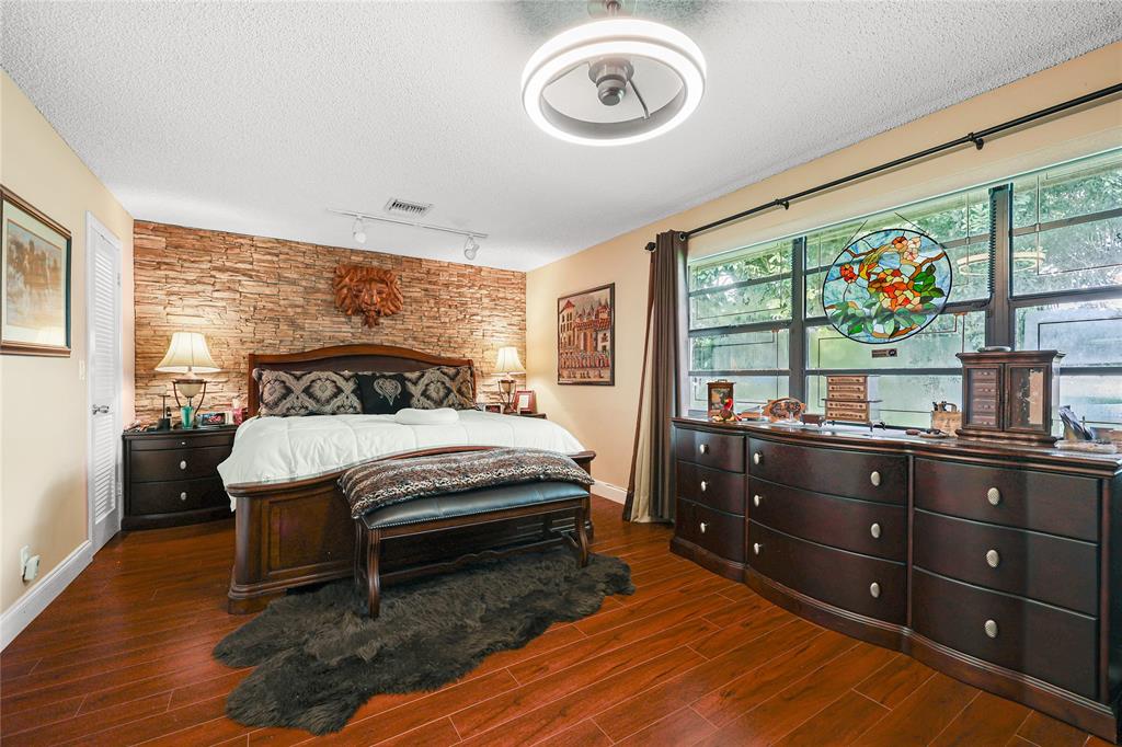 9700 Northwest 28th Street Hollywood, FL 33024 - Photo 31 of 76 a bedroom with a bed and a large window