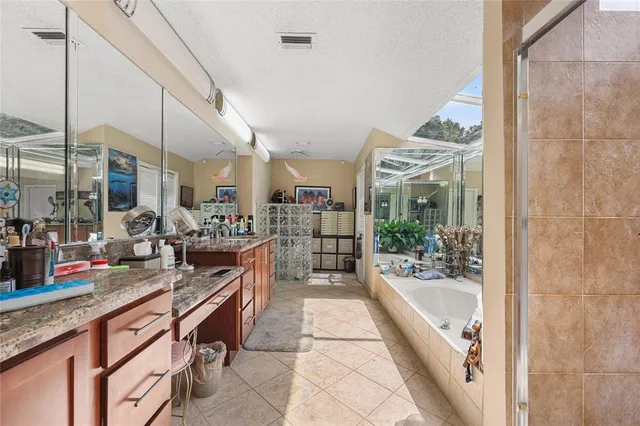 a patio with yard glass top table and chairs