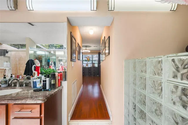 a bathroom with a toilet a sink and a mirror