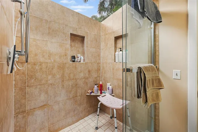 a living room with fireplace furniture and a flat screen tv