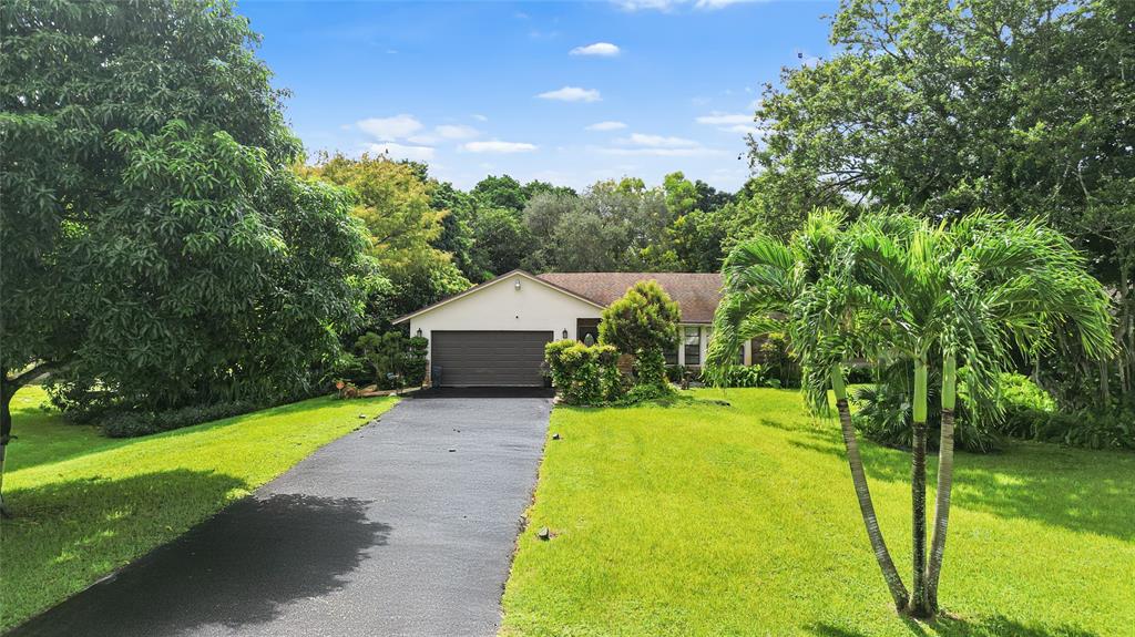 9700 Northwest 28th Street Hollywood, FL 33024 - Photo 70 of 76 a view of back yard of the house