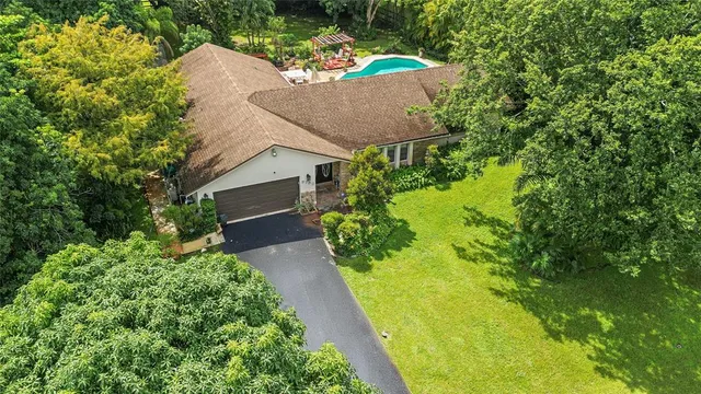 a view of a garage with a backyard