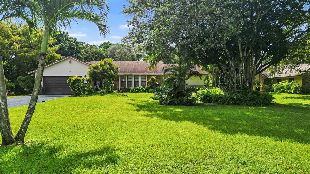 9700 Northwest 28th Street Hollywood, FL 33024 - Photo 73 of 76 a view of a house with a yard