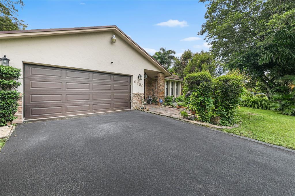 9700 Northwest 28th Street Hollywood, FL 33024 - Photo 8 of 76 a view of a garage with a backyard