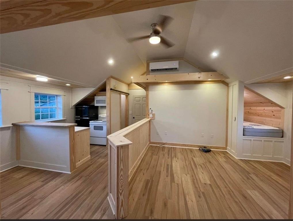 4729 Willie Robinson Road Gainesville, GA 30506 - Photo 5 of 18 a view of kitchen with refrigerator microwave and wooden floor