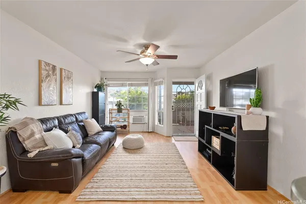 a living room with furniture and a flat screen tv