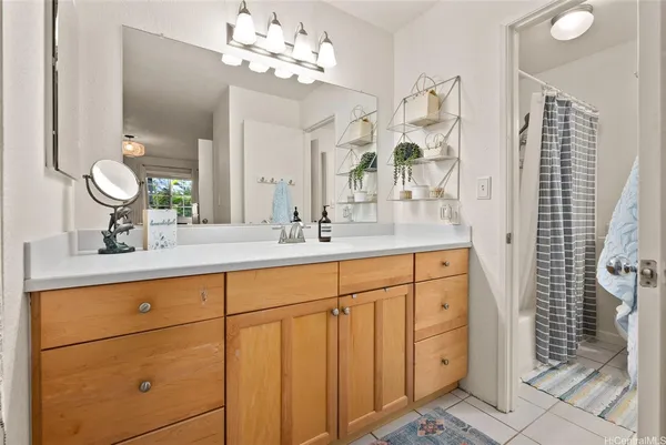 a bathroom with a double vanity sink mirror and double