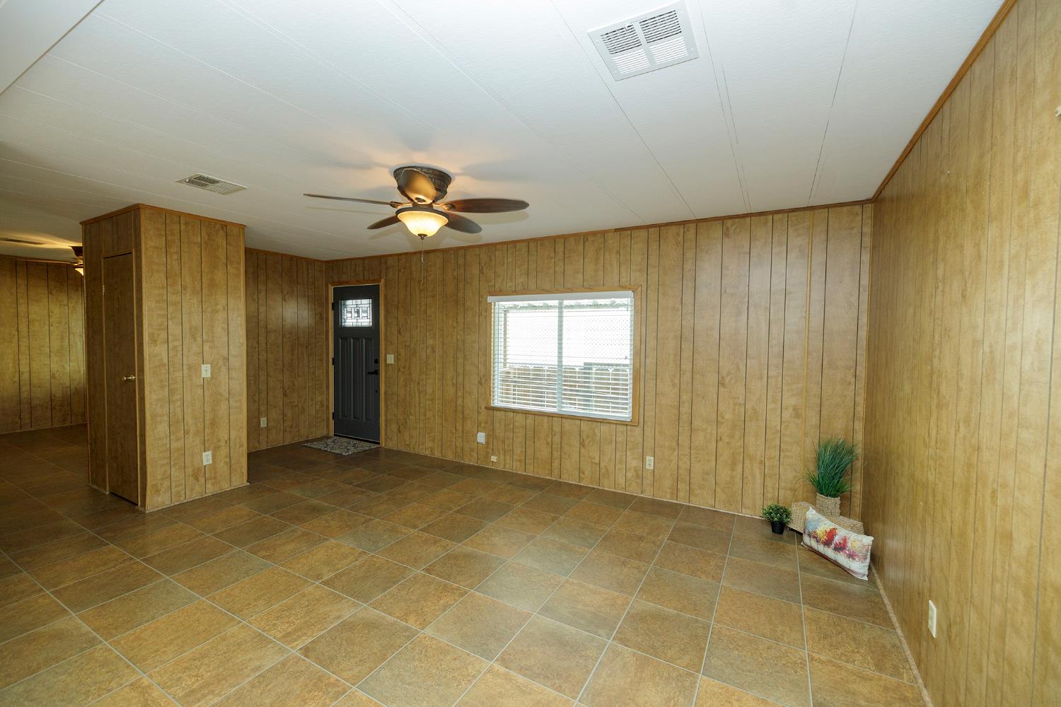 3418 North Waring Road, Unit 24 Denair, CA 95316 - Photo 14 of 48 a view of an empty room with a window