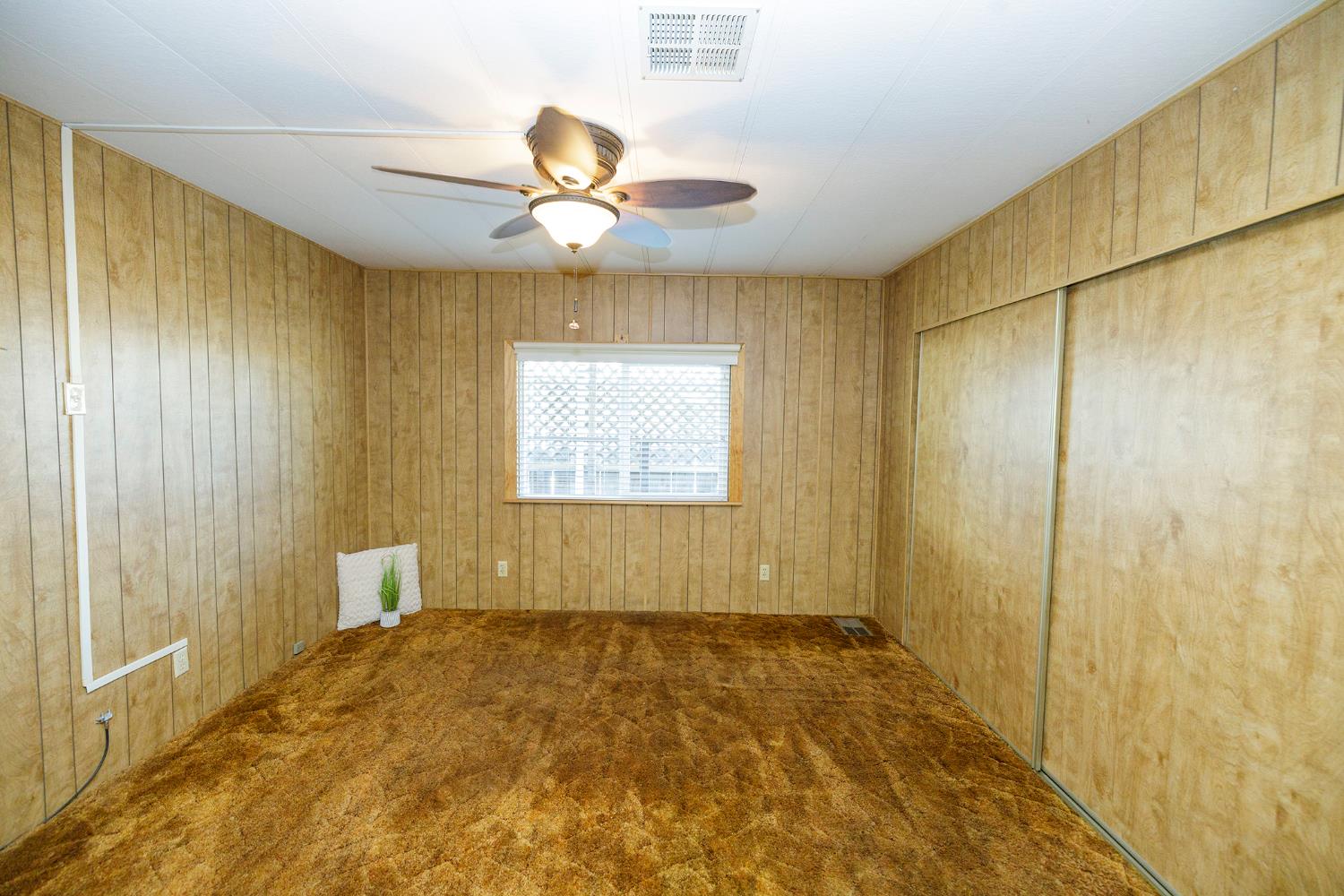 3418 North Waring Road, Unit 24 Denair, CA 95316 - Photo 19 of 48 a view of a livingroom with a windows and ceiling fan