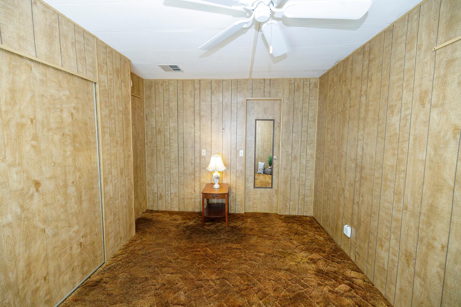 3418 North Waring Road, Unit 24 Denair, CA 95316 - Photo 24 of 48 a view of an empty room and chandelier fan
