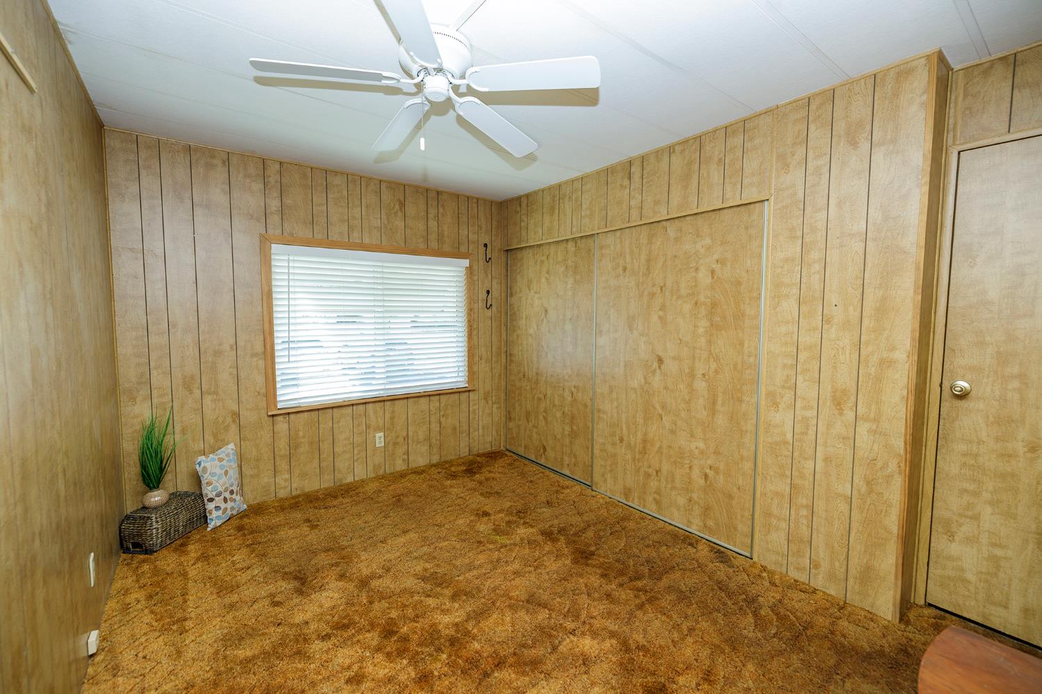 3418 North Waring Road, Unit 24 Denair, CA 95316 - Photo 25 of 48 a view of a room with a window and a ceiling fan