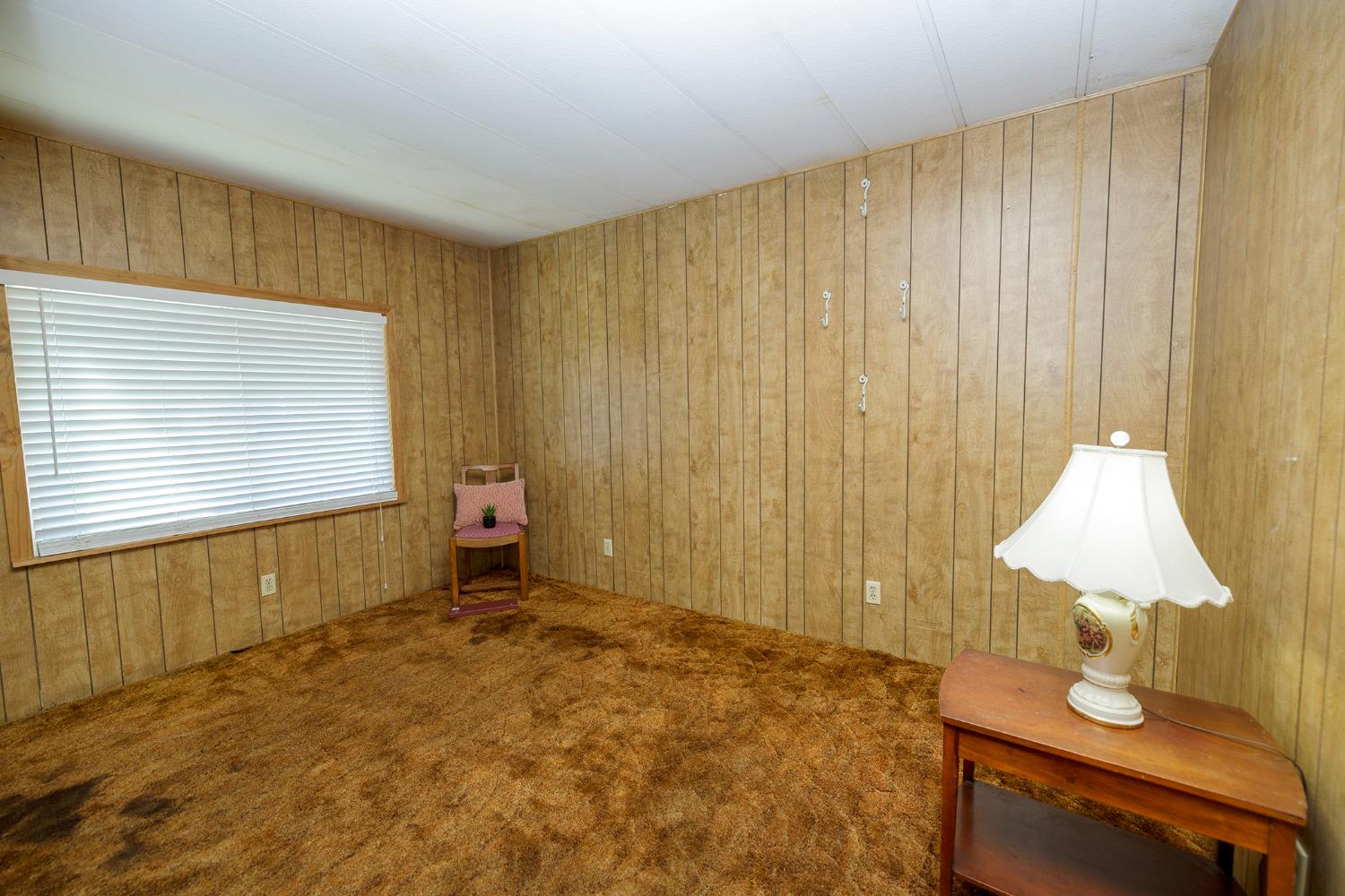 3418 North Waring Road, Unit 24 Denair, CA 95316 - Photo 28 of 48 a bedroom with a bed and a window