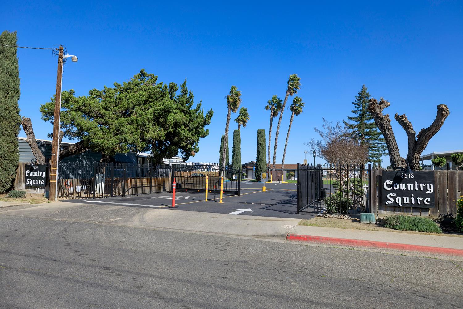 3418 North Waring Road, Unit 24 Denair, CA 95316 - Photo 40 of 48 a row of palm trees sitting in front of a building