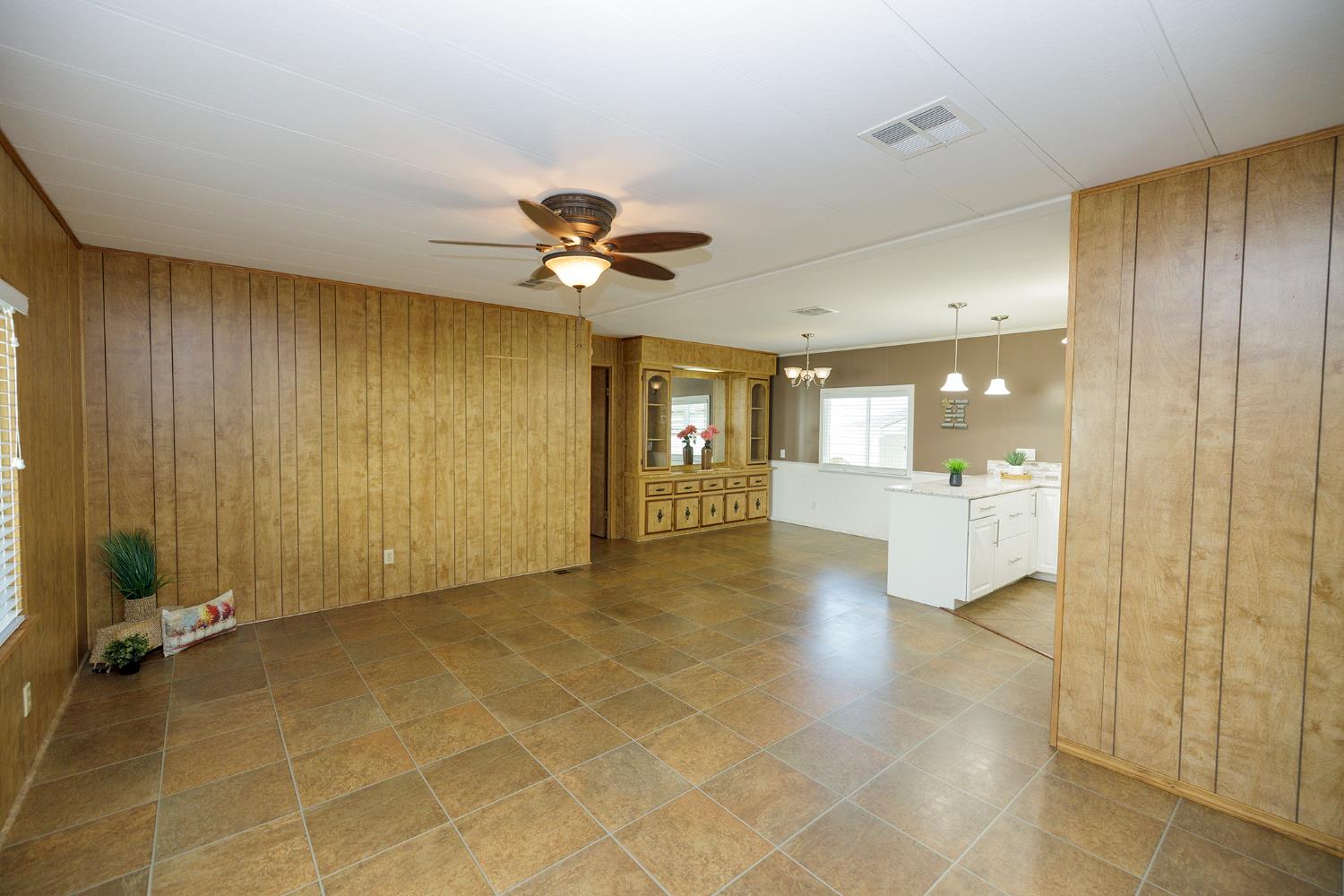 3418 North Waring Road, Unit 24 Denair, CA 95316 - Photo 4 of 48 a view of a hallway with a kitchen