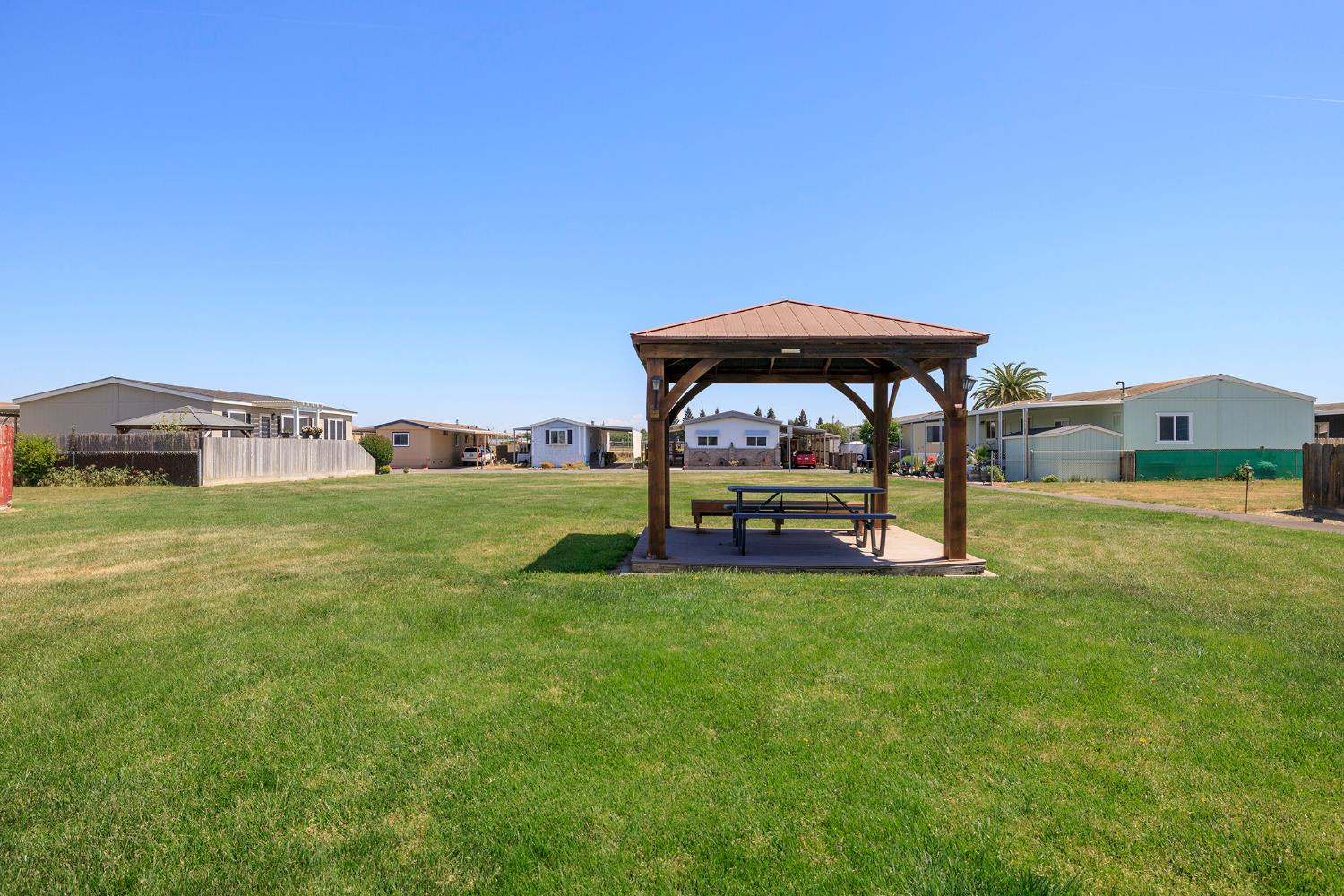 3418 North Waring Road, Unit 24 Denair, CA 95316 - Photo 42 of 48 a view of a house with backyard
