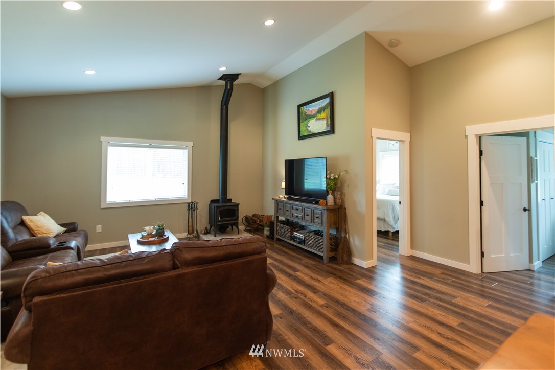 800 Logan Hill Road Chehalis, WA 98532 - Photo 13 of 36 a living room with furniture and a flat screen tv