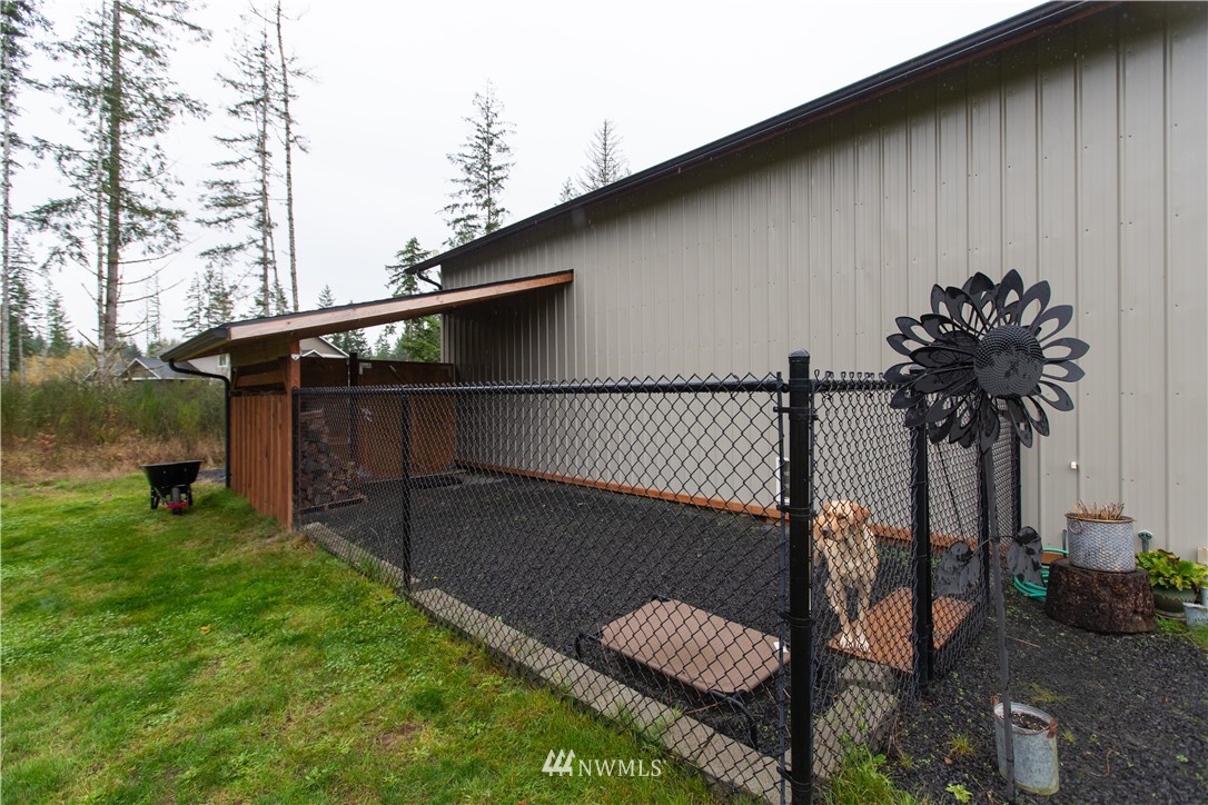 800 Logan Hill Road Chehalis, WA 98532 - Photo 34 of 36 a backyard of a house with table and sofas