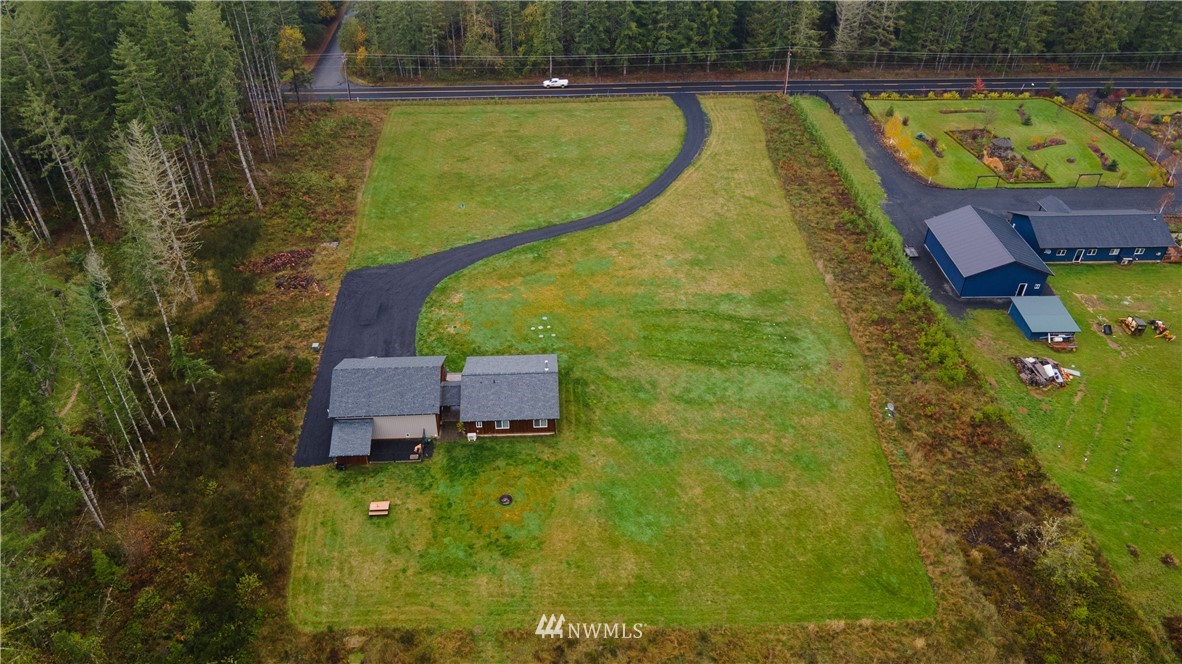 800 Logan Hill Road Chehalis, WA 98532 - Photo 10 of 36 a view of a swimming pool with a lounge chair