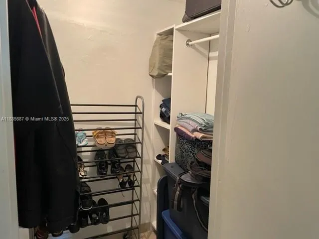 a view of a porch with furniture and a yard