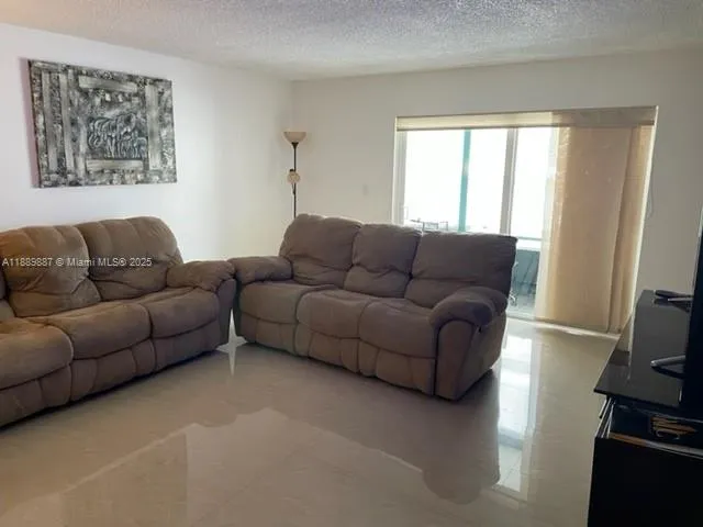 a view of a chair and table in the balcony