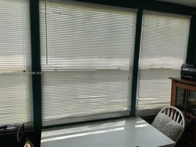 a kitchen with a stove refrigerator and microwave