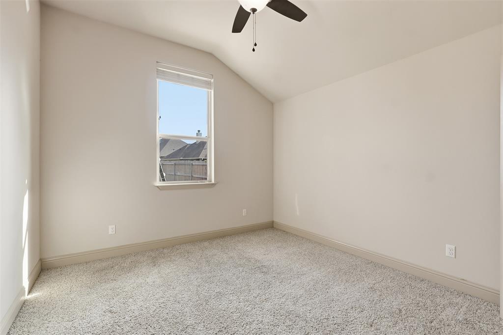 2512 Guinn Farms Road Tyler, TX 75707 - Photo 29 of 29 an empty room with a window and a ceiling fan