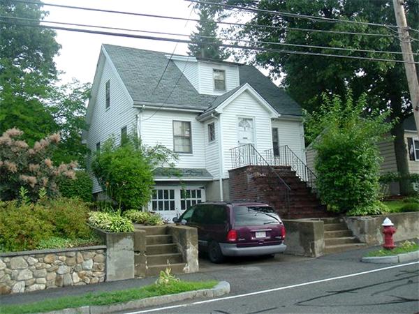 a car parked in front of a house