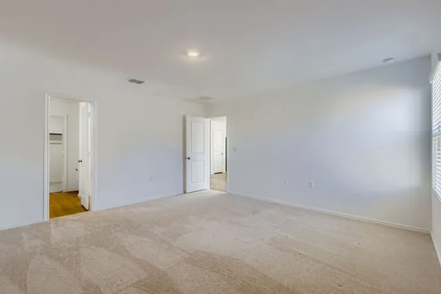 a bathroom with a sink double vanity and a mirror