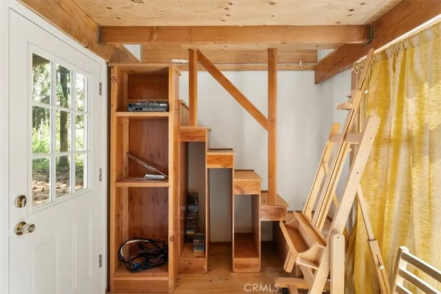 a view of front door and wooden floor