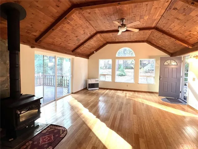 a view of an empty room and a window