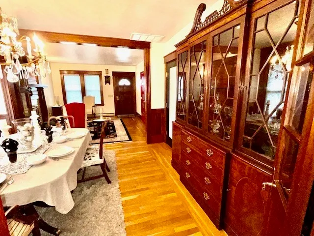a view of a dining room with furniture and wooden floor