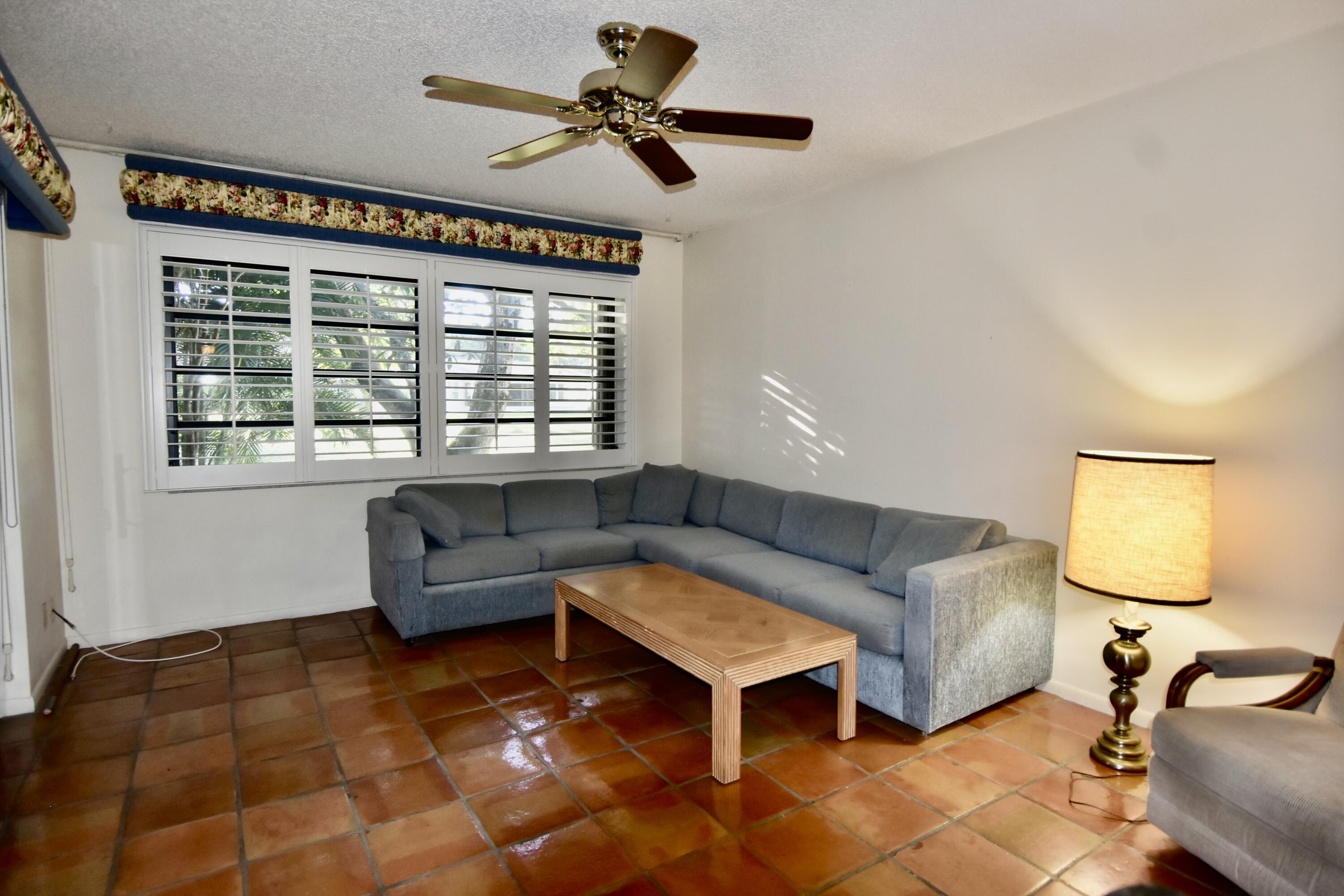 18101 Grove Avenue Boca Raton, FL 33498 - Photo 7 of 12 a living room with furniture and a window