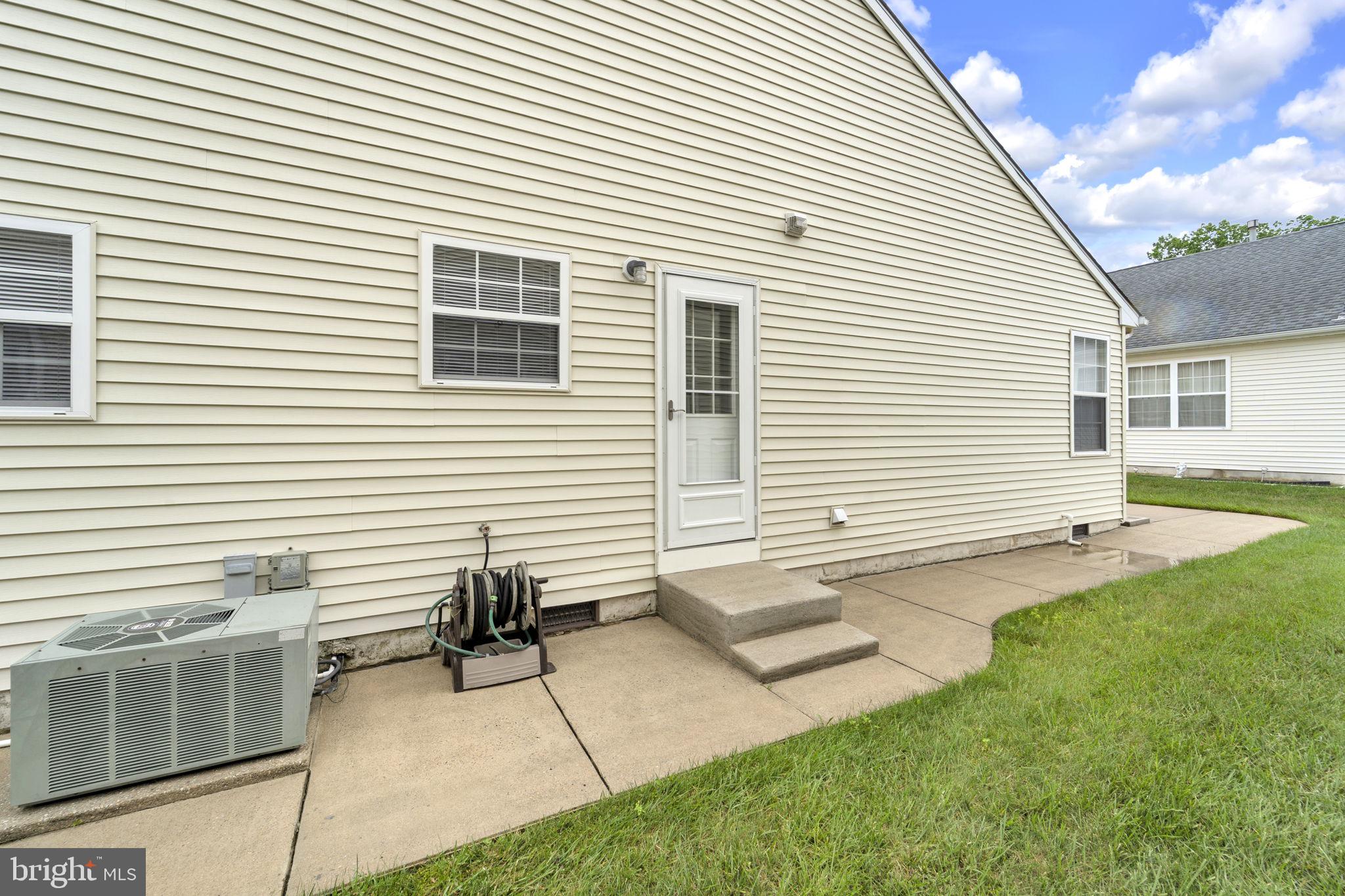 801 Freeport Way Williamstown, NJ 08094 - Photo 27 of 29 a view of a house with a backyard and a table and chairs